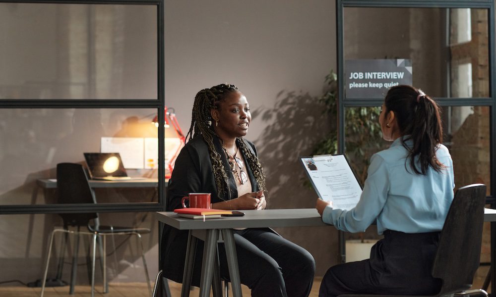 New Year, Same PEC/ Your Exclusive Staffing Captive Program - Two woman sitting at a table conducting a job interview